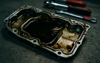 oil-stained aluminium engine oil sump gasket from a Land Rover Ingenium 2.0D engine