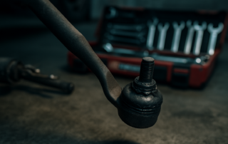 worn Kia Cee'd steering tie rod end with visible play and grease leak